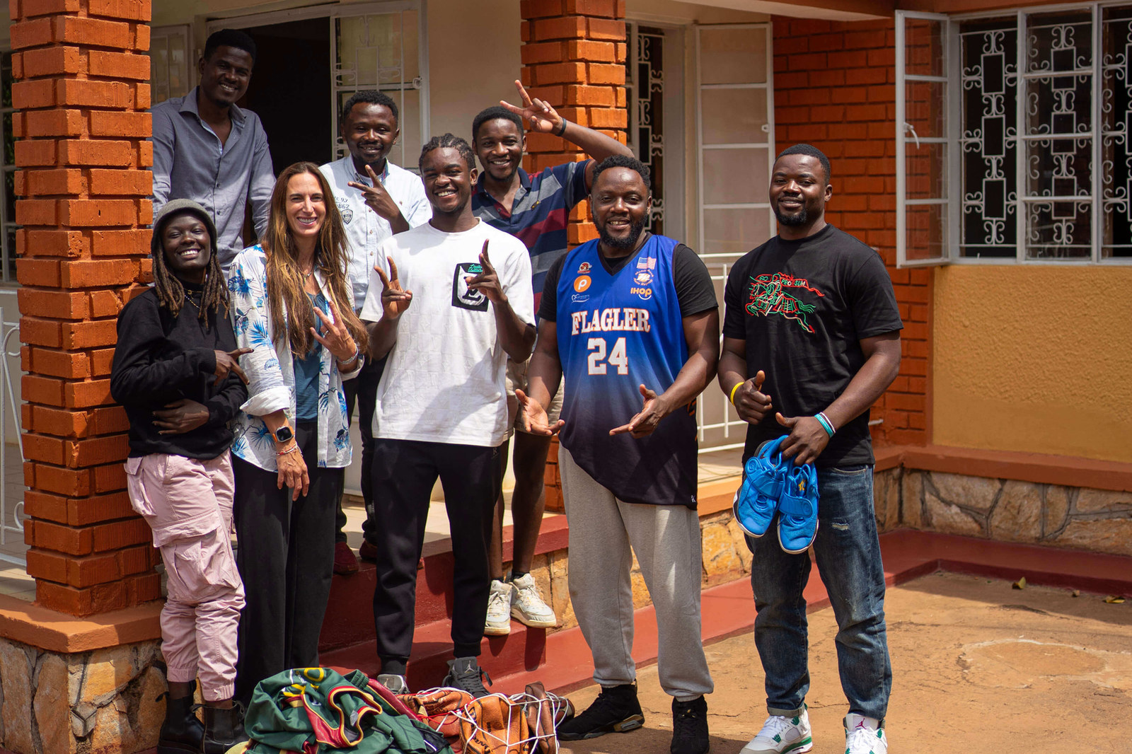 A team of young entrepreneurs in front of their brick-built premises
